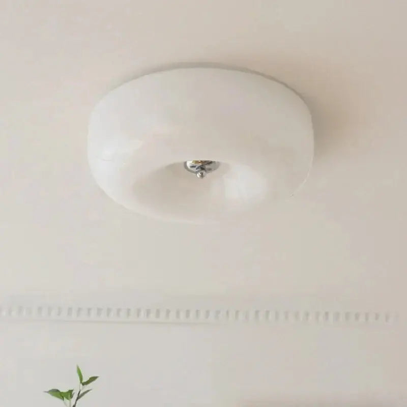 A sleek white frosted glass ceiling lamp with polished chrome center decorbites french cream for bedroom lighting