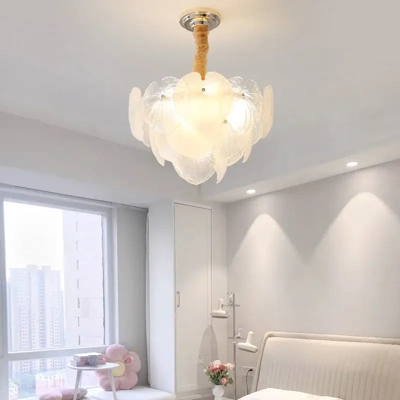 Delicate French cream crystal chandelier with white petal glass, wooden stem, and chrome fixture for living room decorbites decor