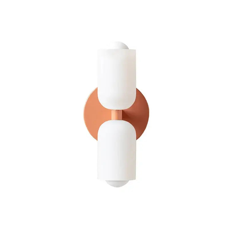 Copper-toned french cream double headed brass wall lamp with two white frosted glass shades for bedroom decorbites french cream