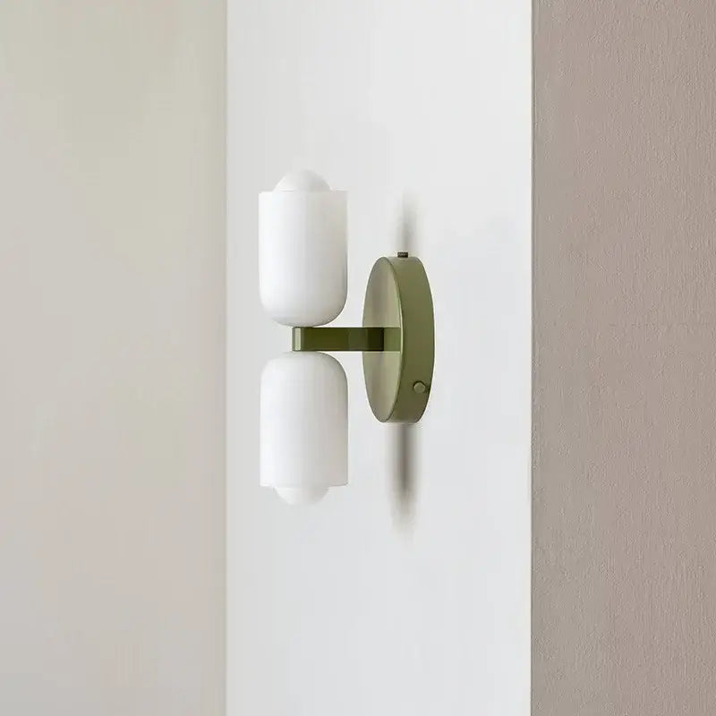 Modern olive green wall lamp with two frosted white cylindrical shades decorbites french cream double brass design for bedroom