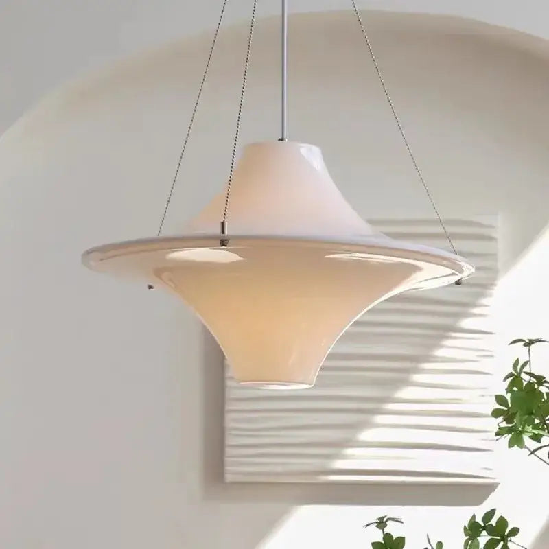 A cream modern chandelier featuring a sleek off-white ceramic pendant with metal chains for dining room decorbites french cream