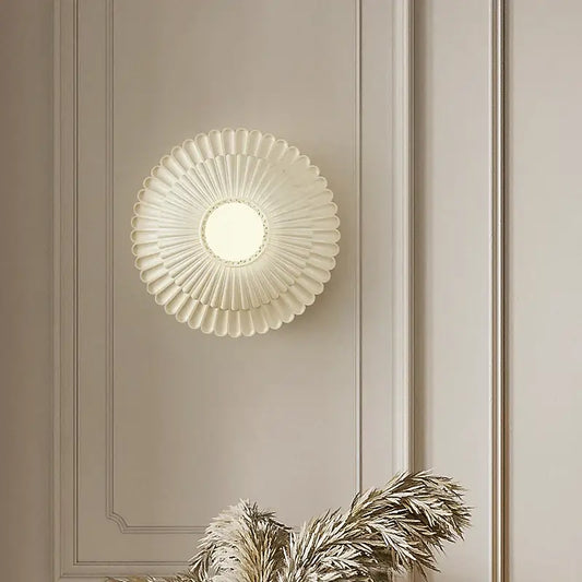 Cream-colored petal-shaped french cream wall lamp with central circular light fixture for bedroom decorbites french cream wind