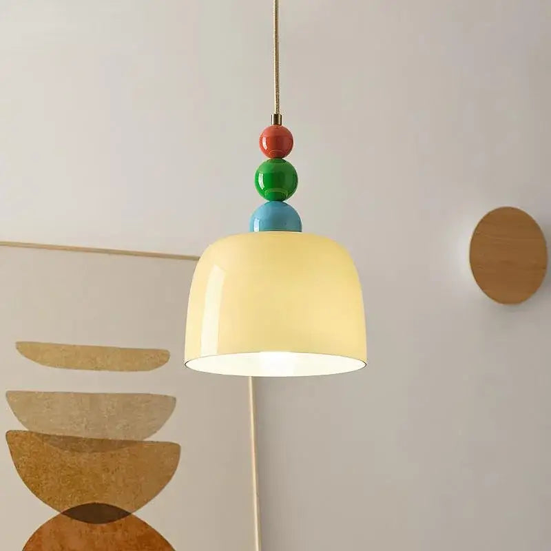 A decorbites french cream style ceramic pendant light with creamy off-white shade and colorful stacked beads chandelier