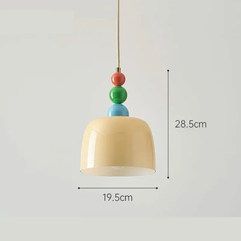 Cream style chandelier featuring a cream-colored ceramic pendant light with a slender brass chain and colorful beads decorbites french cream
