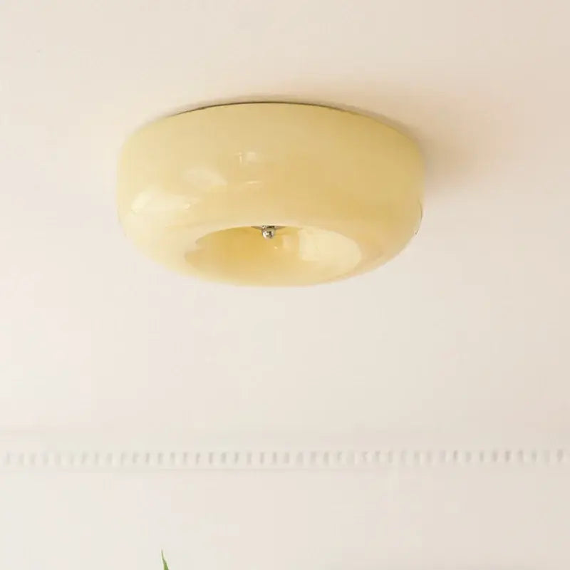 Cream-colored glossy acrylic french cream ceiling lamp with smooth rounded design for bedroom decorbites french cream