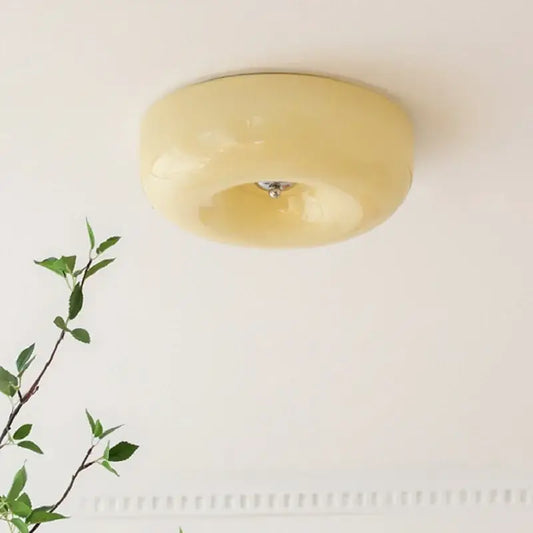 Cream-colored translucent glass ceiling lamp with smooth rounded design decorbites french cream for bedroom decor