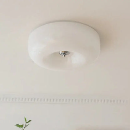 A sleek french cream ceiling lamp with white frosted glass and polished chrome center for bedroom decorbites french cream