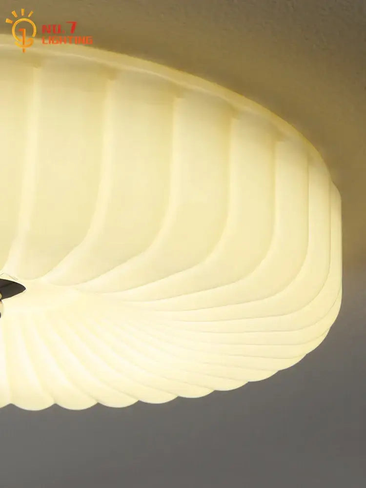 Cream wind ribbed glass ceiling lamp in French cream with chrome fixture providing a soft diffused glow for decorbites cream wind