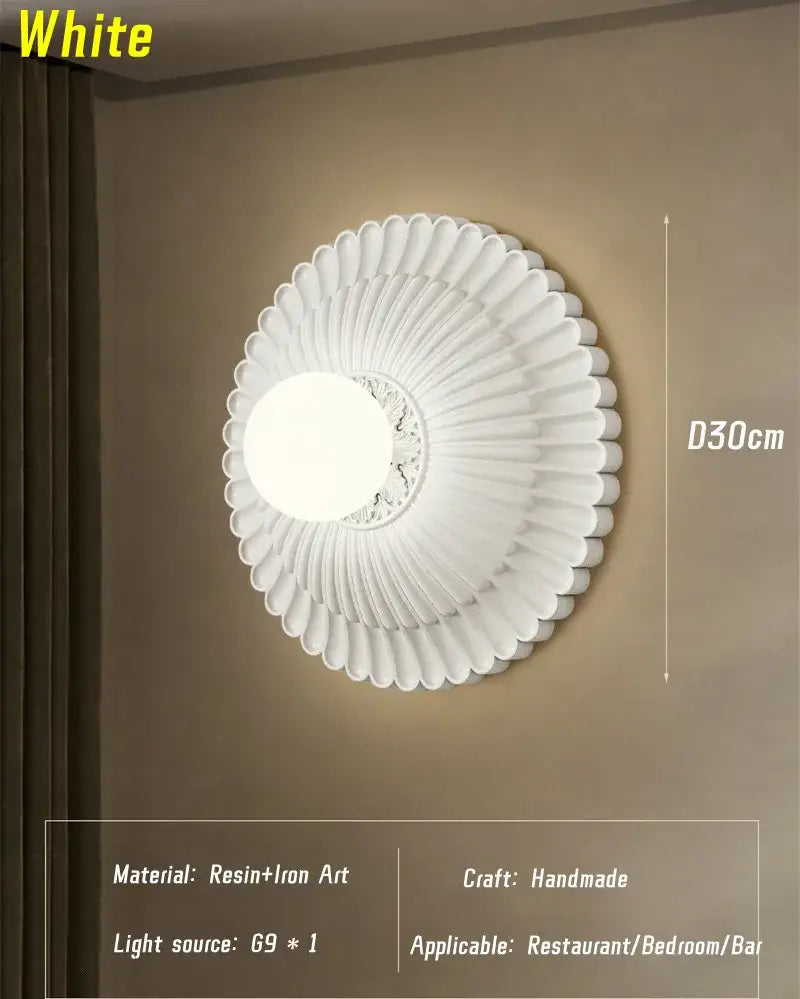 White circular wall lamp with fluted resin and iron art design from decorbites french cream wind collection
