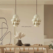 Off-white creamy wind led cloud pendant light with matte textured surface hanging from dark cords for dining room decorbites french creamy