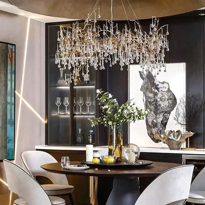 A french crystal chandelier with golden metal frame and cascading crystals for elegant dining room decorbites french crystal lighting