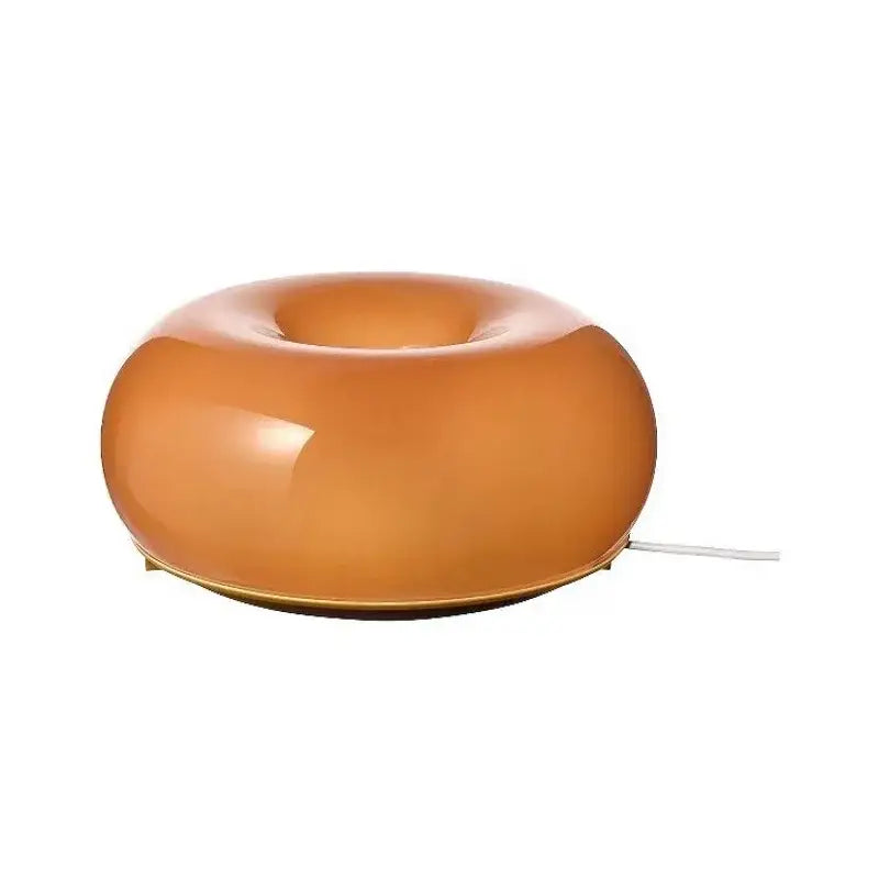 A sleek translucent amber french decorative wall lamp with a glossy finish and power cord for bedside decorbites wall lamps