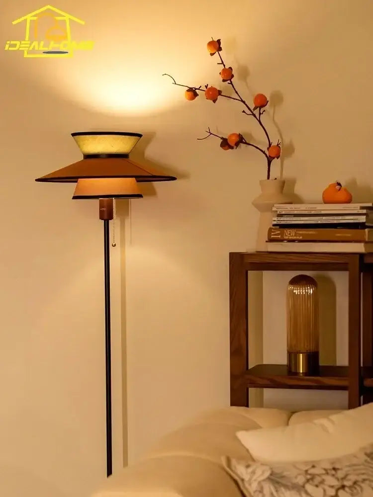 Warm-toned tiered floor lamp with slender black pole and amber glass shades decorbites french design vertical lamp