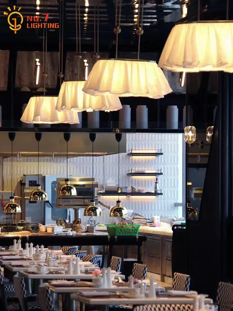 Cream-colored pleated fabric pendant lights with metallic fixtures for dining room decorbites french design led