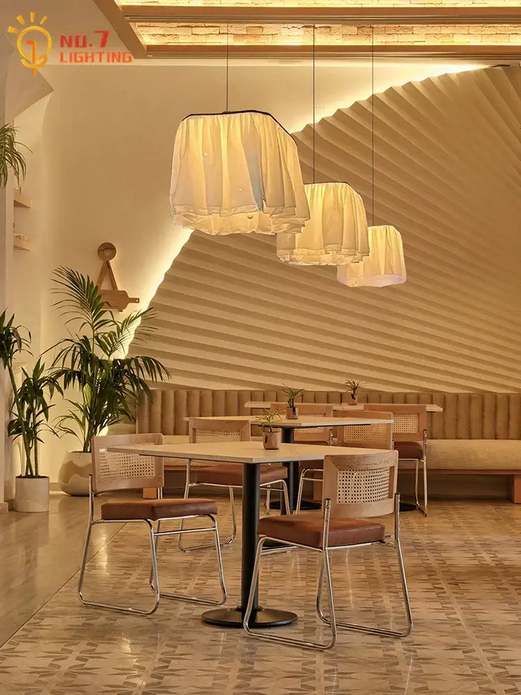Warm-toned pleated fabric pendant lights with soft glow by decorbites french design for dining room lighting