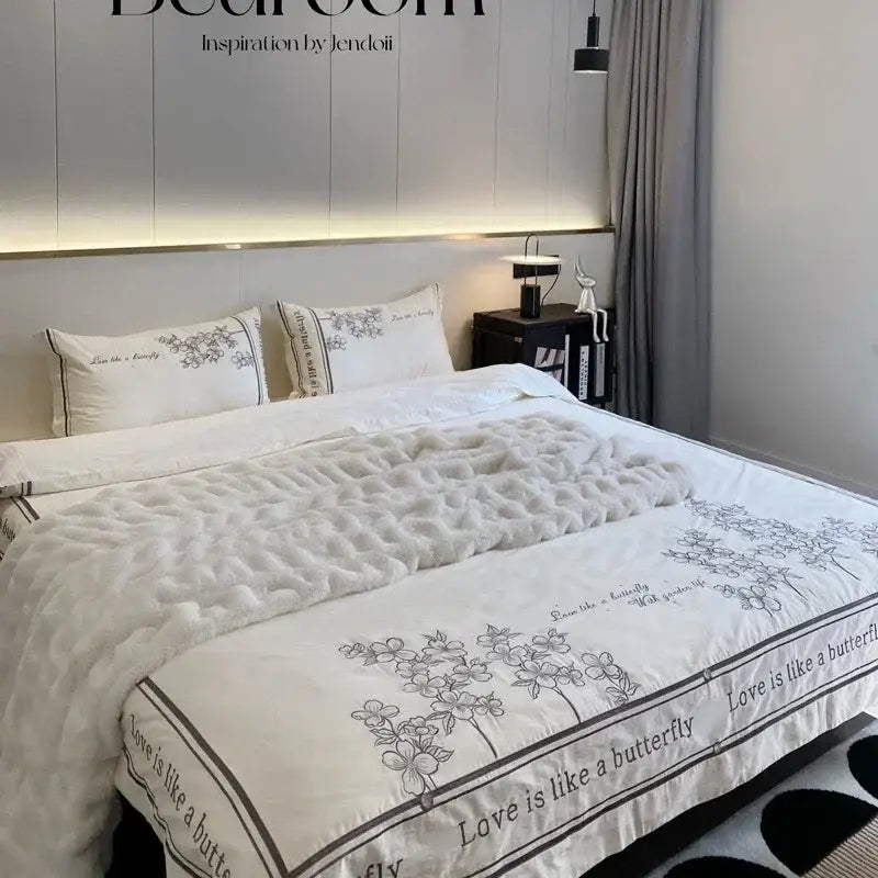 White quilted french embroidered cotton bedding set with black floral embroidery and love is like a butterfly border for decorbites french embroidered bedroom decor