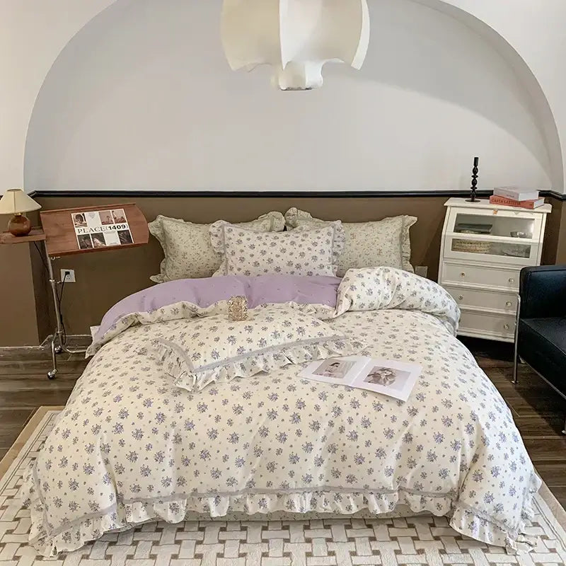 Cream-colored bedding set with lavender floral patterns and soft ruffled edges for decorbites french floral decor