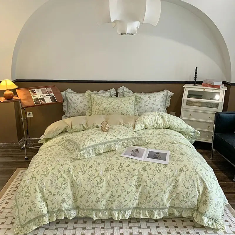Light green floral-patterned bedding set with ruffled edges and matching pillows from decorbites french floral collection