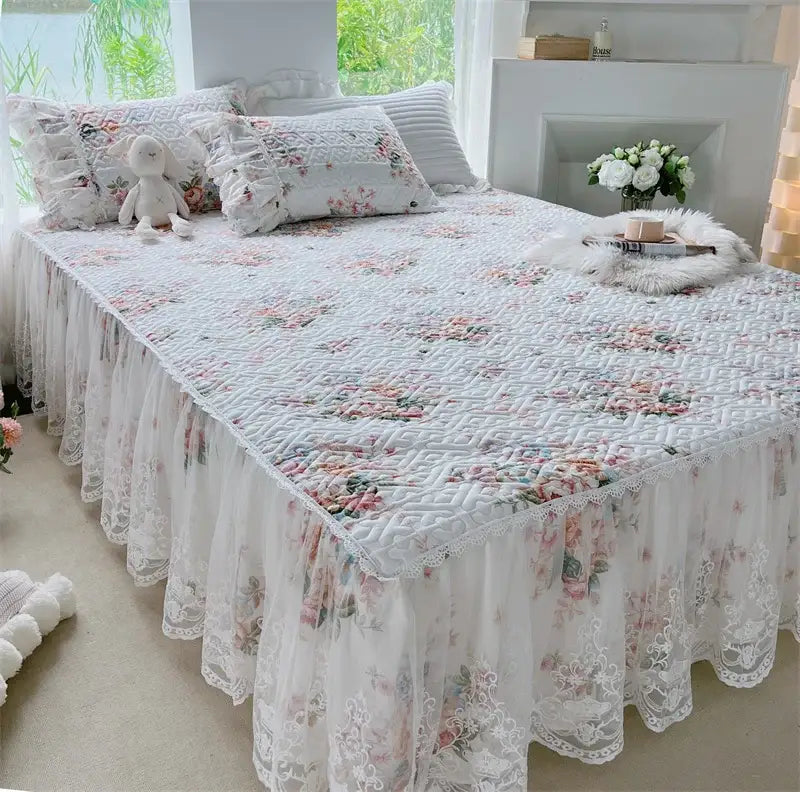 White floral quilted bedding set with lace trim and ruffled hem featuring decorbites french floral print design