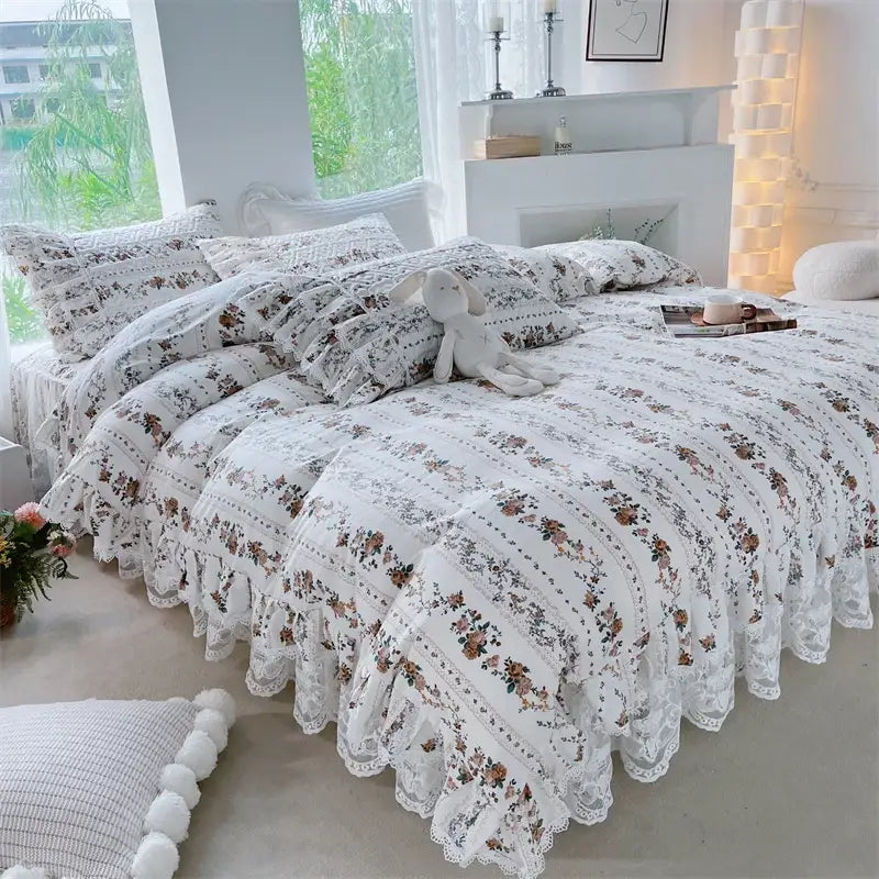 White bedding set with delicate lace trim and ruffled edges featuring decorbites french floral print design
