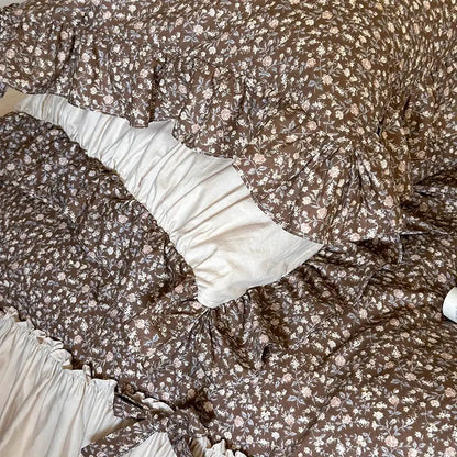 Brown floral-patterned quilt with ruffled edges and cream lining in decorbites french floral washed cotton bedding set