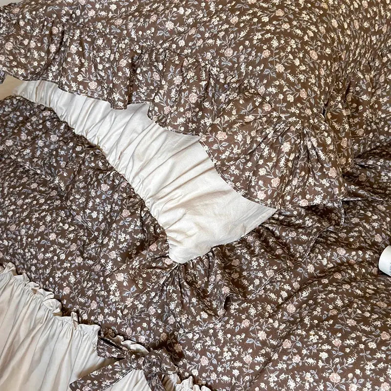 Brown floral-patterned quilt with ruffled edges and cream lining in decorbites french floral washed cotton bedding set