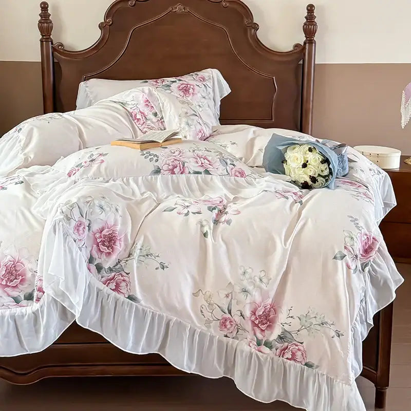 A delicate ivory satin bedding set with french flowers lace and a soft pink white floral print with ruffled hem by decorbites french flowers