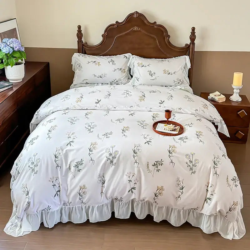 White floral-patterned bedding set with delicate french flowers lace ruffles and soft flowing fabric by decorbites french flowers