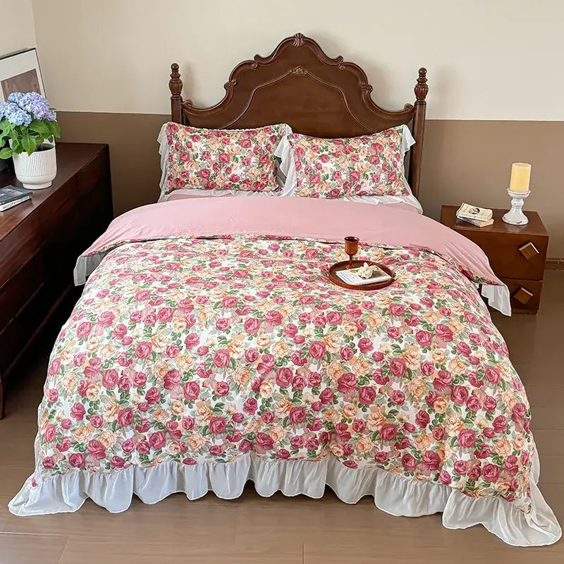 Pink floral comforter with ruffled white trim and matching pillowcases in decorbites french flowers lace bedding set
