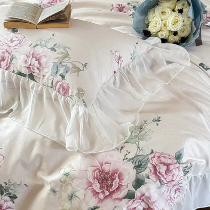 A cream pillow sham with pink and green floral embroidery and ruffled white edge from decorbites french flowers lace bedding set