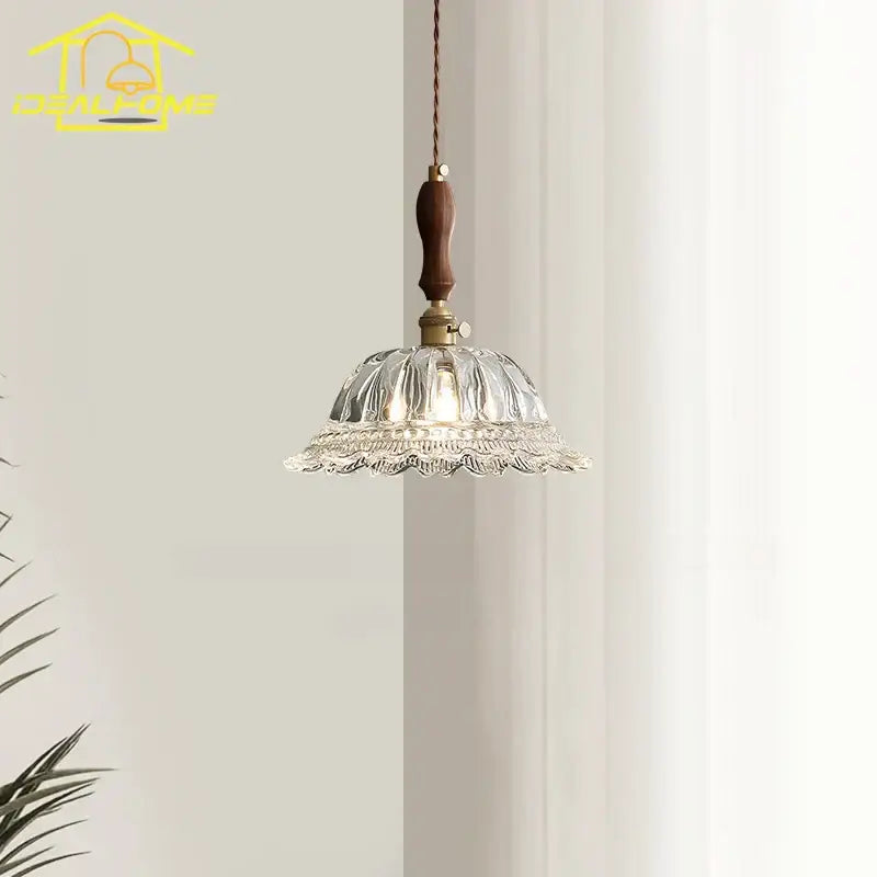 A delicate clear glass pendant light with fluted design and dark wood handle for decorbites french ins walnut kitchen islands