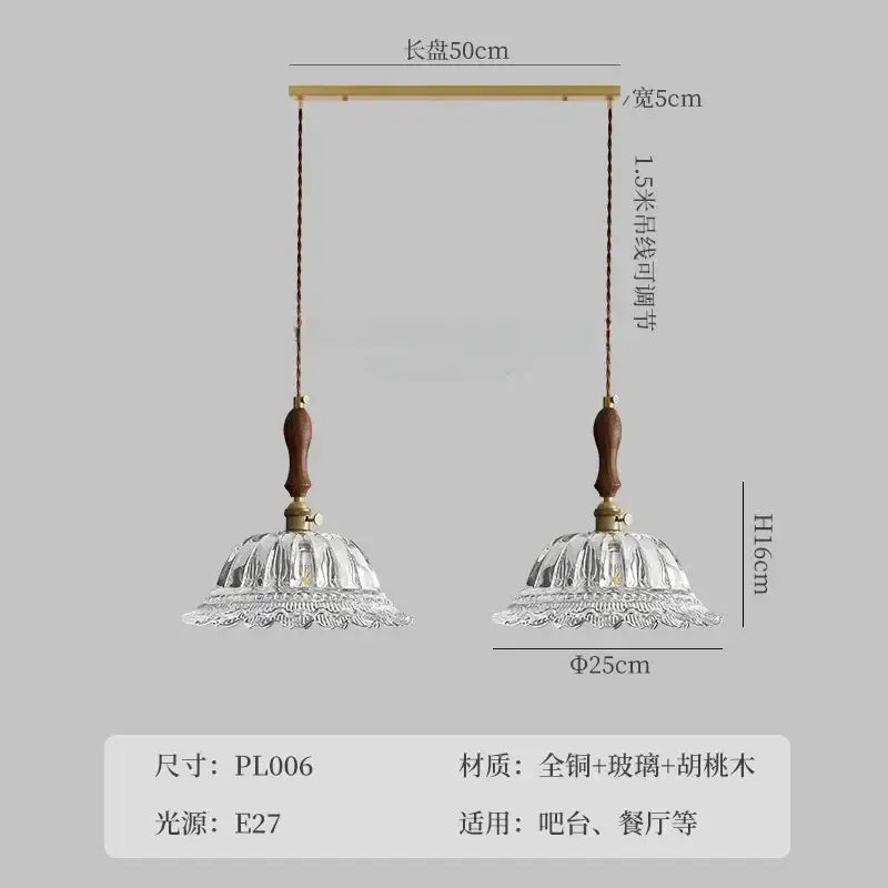A pair of decorbites french ins walnut brass glass pendant lights with fluted clear shades and wooden handles for kitchen islands