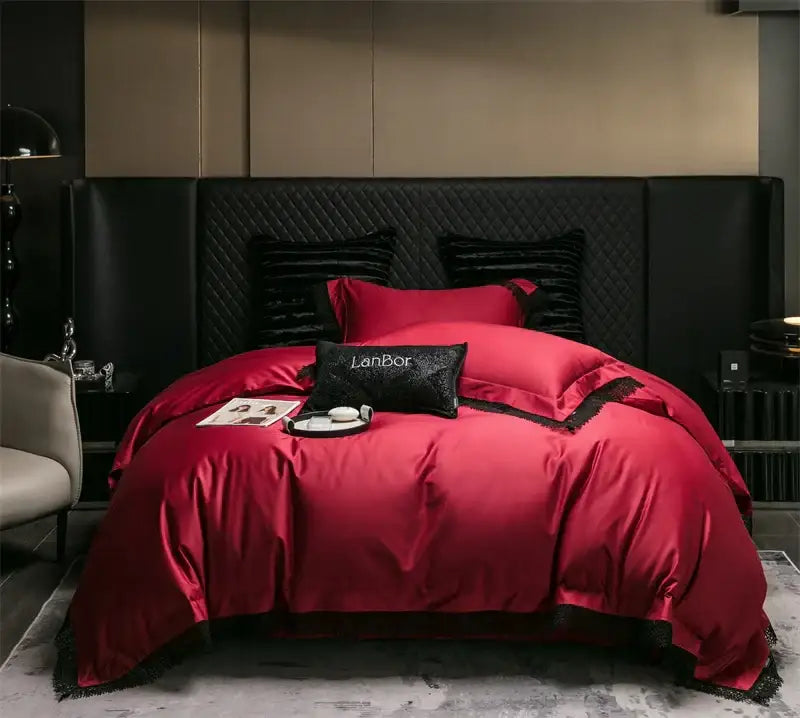 Red satin bedding set with black lace trim and matching pillows on quilted headboard decorbites french lace edge