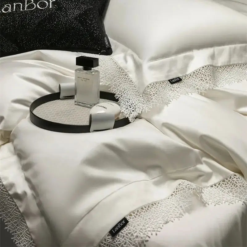 White satin bedding set with delicate french lace edge trim and lanbor brand tags for decorbites french lace collection