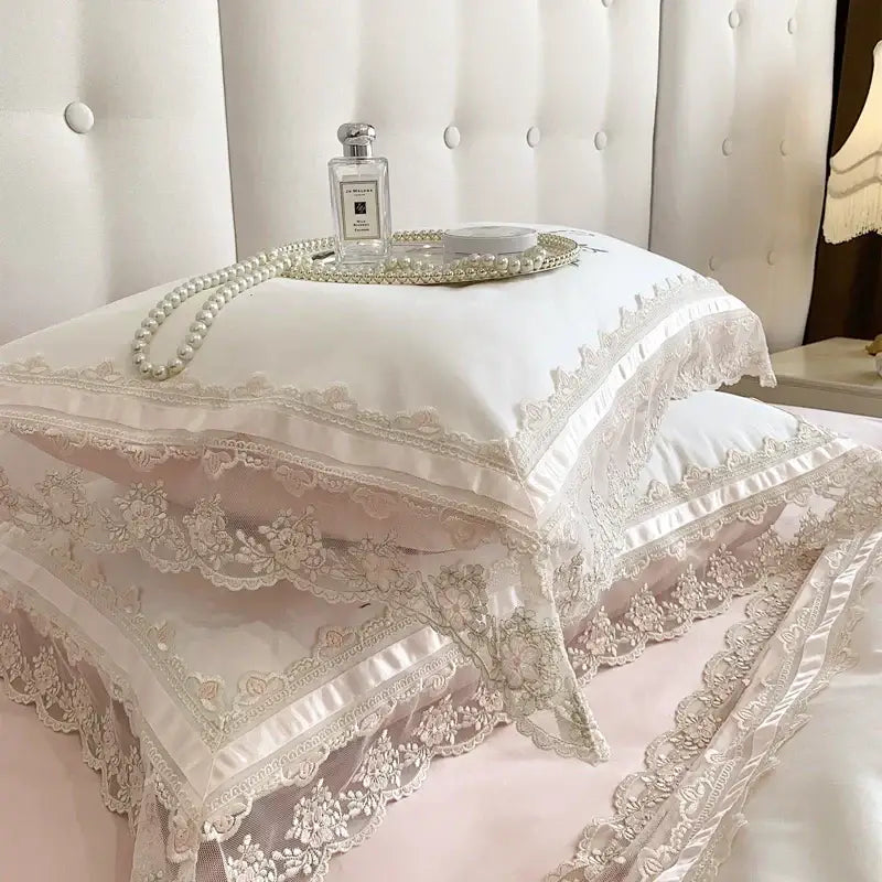 Elegant white lace pillowcases with satin trim and delicate floral embroidery from decorbites french lace bedding set