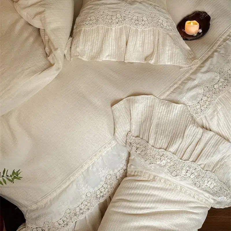 Cream-colored linen bedding set with delicate white french lace ruffle trim perfect for decorbites french lace decor