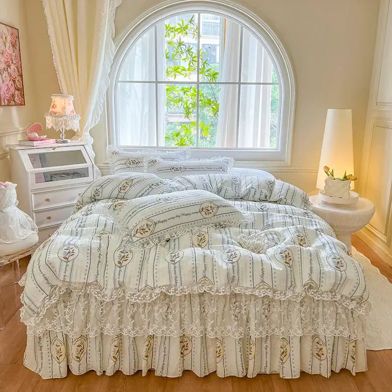 Cream-colored bedding set with delicate lace trim and vintage floral pattern in soft gray and gold by decorbites french lace ruffles