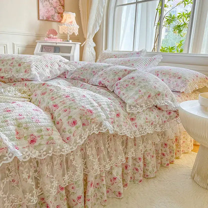 A delicate ivory quilted bedding set with pink rose floral patterns and french lace ruffles decorbites french lace