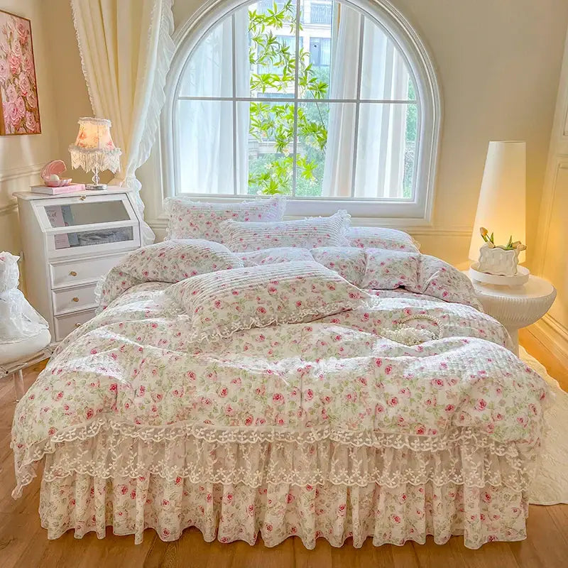 A cream floral bedding set with delicate ruffled lace trim and soft pink roses from decorbites french lace ruffles collection