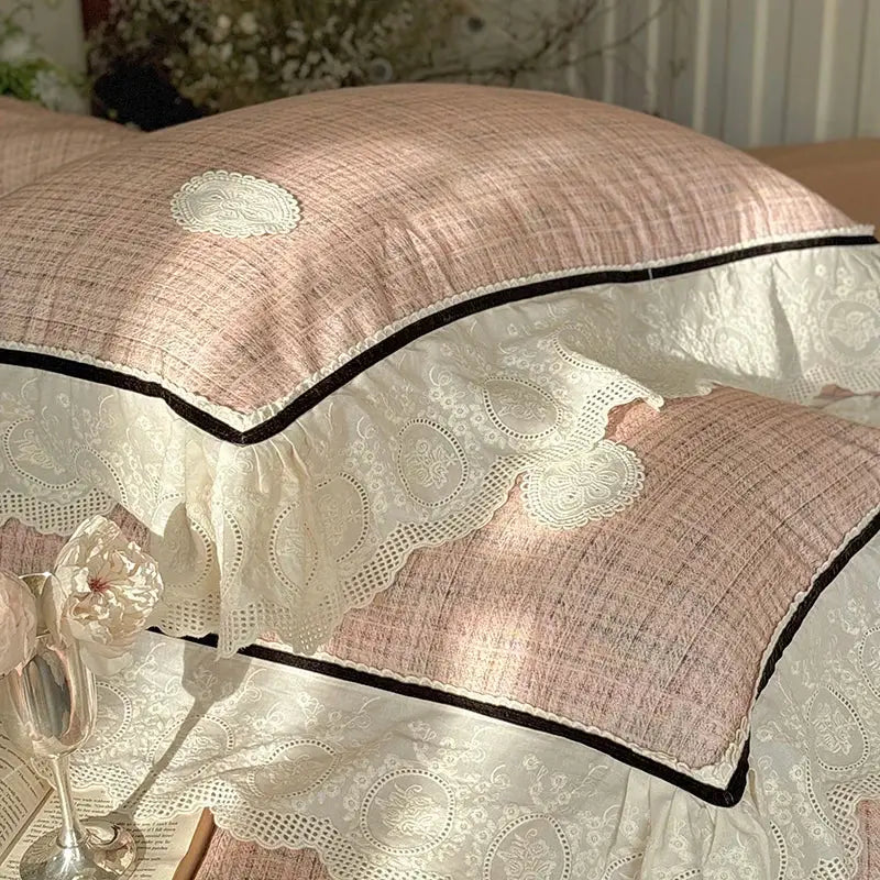 Pink textured pillow sham with cream lace ruffles and black piping part of decorbites french lace bedding set in egyptian cotton