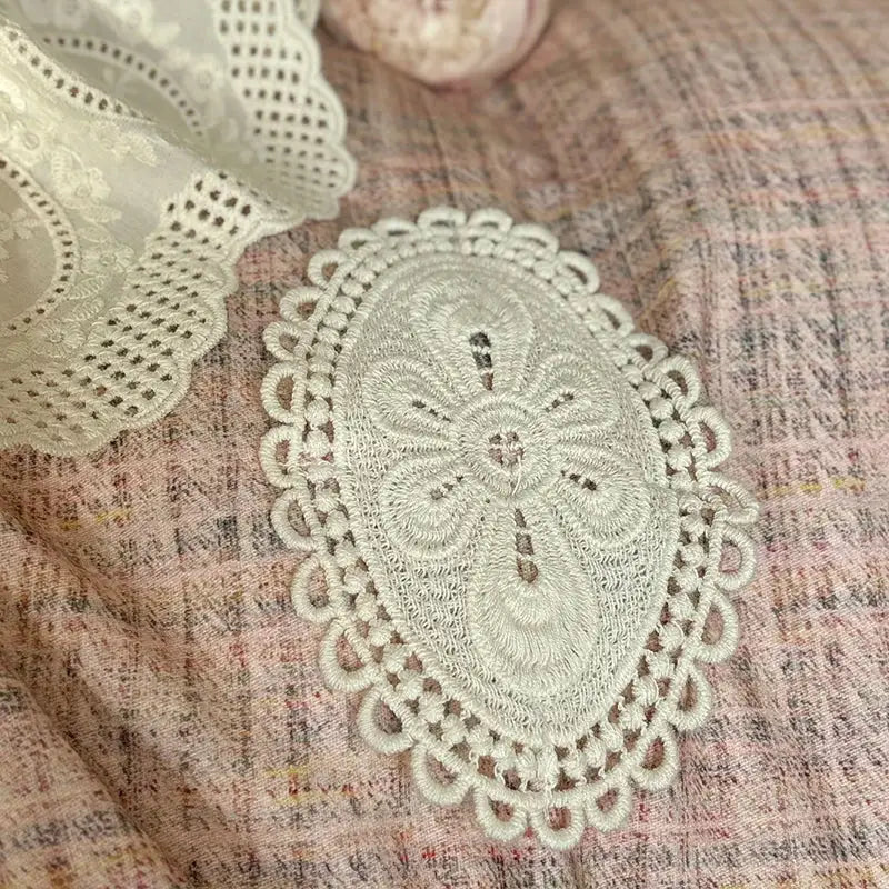 Cream-colored oval lace doily with intricate floral embroidery and scalloped edges for decorbites french lace bedding set