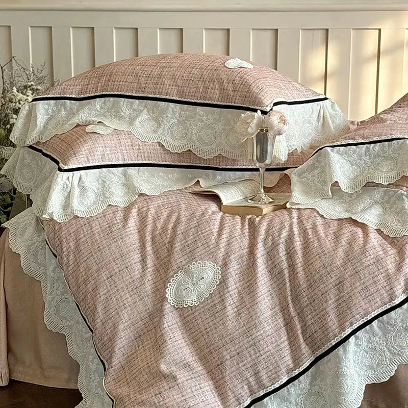 Pink textured bedding set with delicate white lace ruffles and black trim made of egyptian cotton decorbites french lace