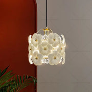 Elegant white flower glass chandelier with gold-toned centers and black rod for light luxury bedroom decorbites french light