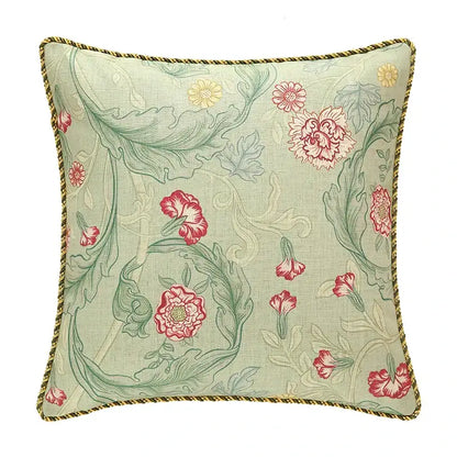 A french linen flax pillow cover with light green fabric, floral pattern, and gold braided trim for decorbites french linen decor