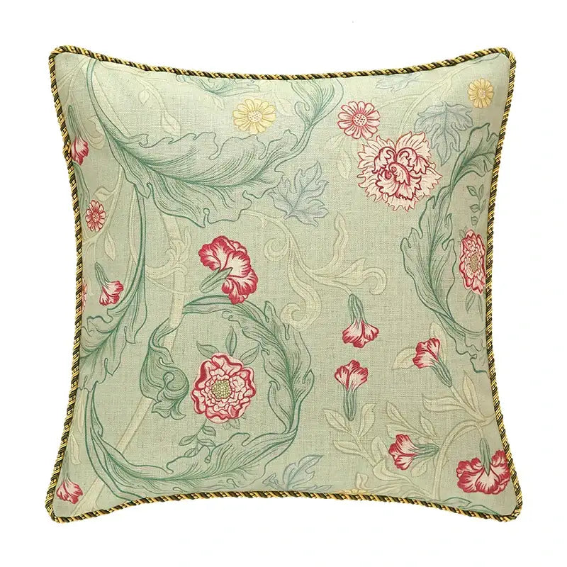 A french linen flax pillow cover with light green fabric, floral pattern, and gold braided trim for decorbites french linen decor
