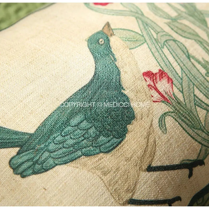 A teal bird with detailed feathers and brown beak printed on textured off-white french linen flax pillow cover decorbites