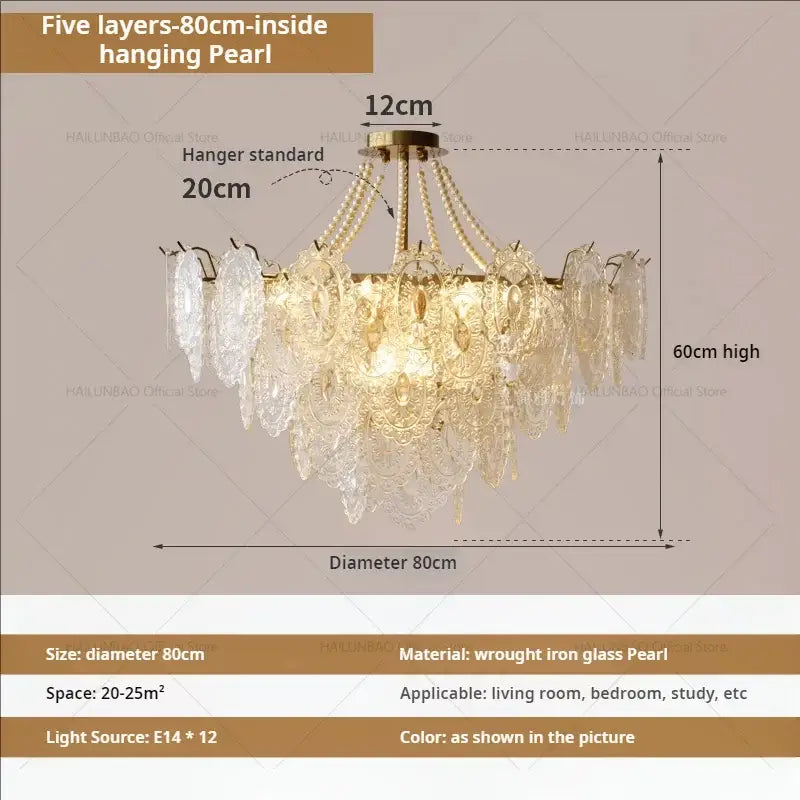 A multi-tiered decorbites cream crystal chandelier with five layers of glass pearls on a brass wrought iron frame