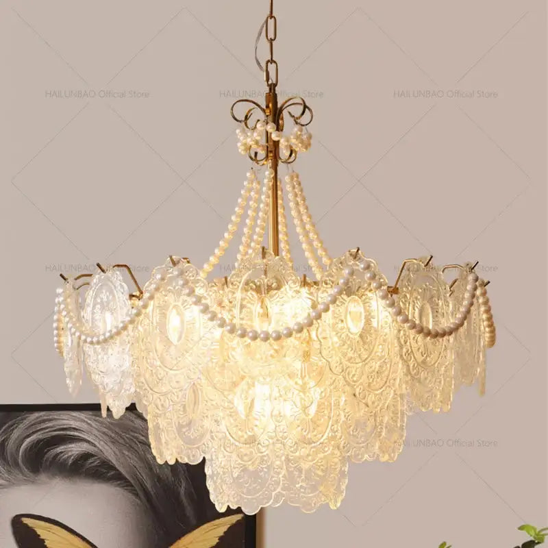 Gold-toned decorbites cream crystal chandelier with layered translucent crystal lace shades and pearl strands for living room