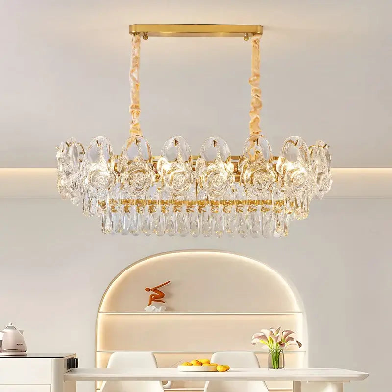 Gold-toned decorbites crystal rose chandelier with clear crystal roses and dangling teardrop crystals for dining room decor