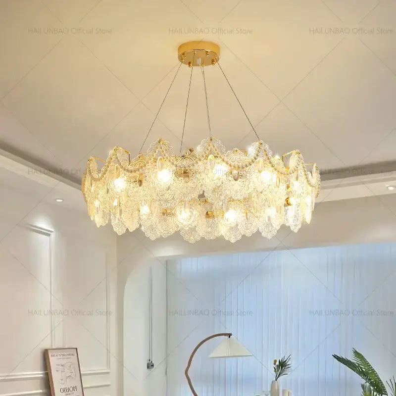 Elegant gold-toned decorbites glass chandelier with intricate crystal leaf-like shades for dining room luxury decor